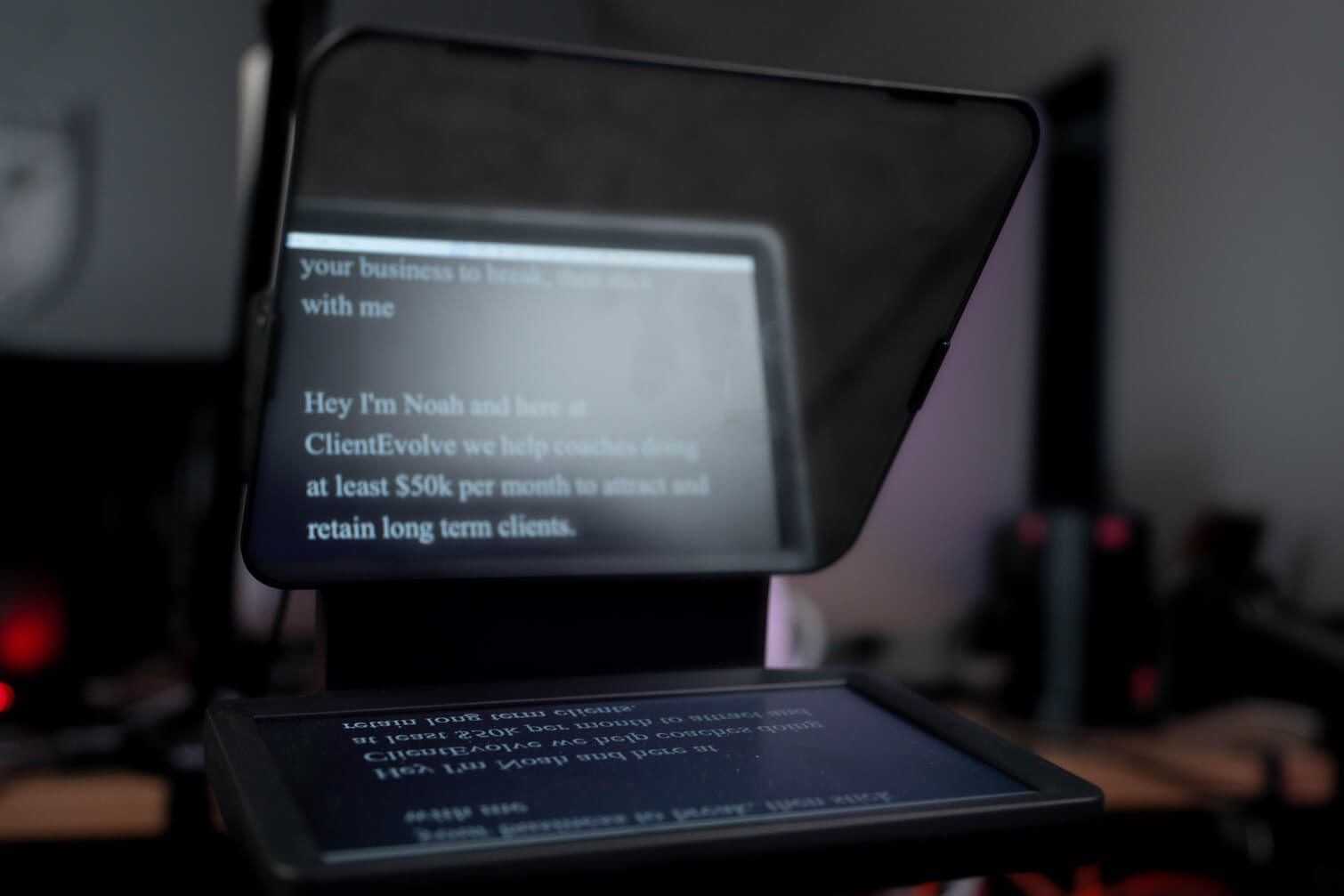The Content Factory A device with a screen displaying text is shown in the foreground, set against blurred office equipment. The Content Factory's podcast studio in Austin, Texas, employs such advanced technology to create an efficient and modern workplace atmosphere. In Austin, Texas